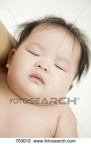 A sleeping baby View Large Photo Image Stock Image - A sleeping baby. Fotosearch