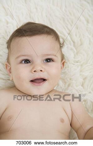 Stock Photograph - A smiling baby, portrait. Fotosearch