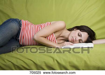 A Latin American woman sleeping on a sofa View Large Photo Image Stock Photography - A Latin American woman sleeping on a sofa. Fotosearch