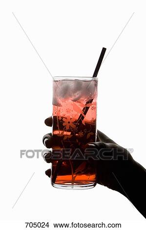 An African American woman's hand holding an iced drink, silhouette View Large Photo Image Picture - An African American woman's hand holding an iced drink, silhouette. Fotosearch