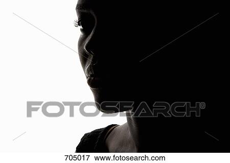 Stock Photo - Portrait of an African American woman, close up, silhouette. Fotosearch