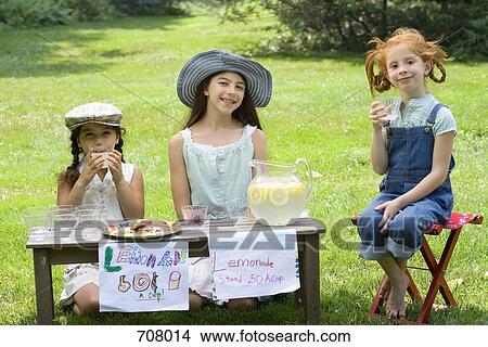 Picture - Three girls with a lemonade stand. Fotosearch