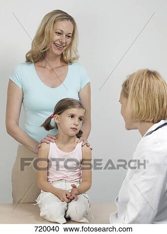 A mother and daughter at medical exam with a pediatrician View Large Photo Image Stock Image - A mother and daughter at medical exam with a pediatrician. Fotosearch