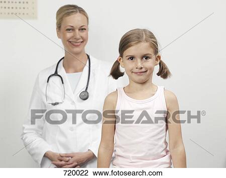 A young girl and a female pediatrician, portrait View Large Photo Image Stock Image - A young girl and a female pediatrician, portrait. Fotosearch