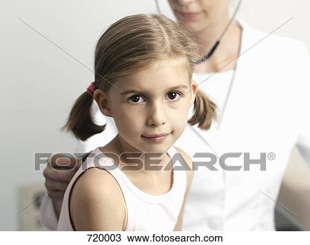 A young girl getting a medical Exam View Large Photo Image Stock Image - A young girl getting a medical Exam. Fotosearch