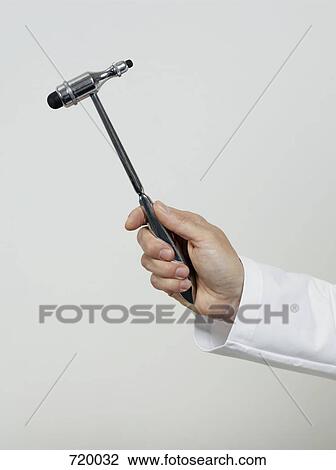 Human hand holding a reflex hammer View Large Photo Image Stock Image - Human hand holding a reflex hammer. Fotosearch