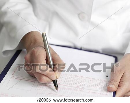 Human hands filling out a referral slip for a doctor View Large Photo Image Stock Photography - Human hands filling out a referral slip for a doctor. Fotosearch