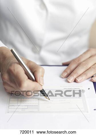 Human hands filling out medical paperwork View Large Photo Image Stock Image - Human hands filling out medical paperwork. Fotosearch