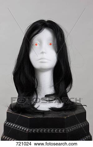 A mannequin on a plinth wearing a wig View Large Photo Image Picture - A mannequin on a plinth wearing a wig. Fotosearch