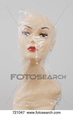Stock Photo - A plastic bag covering a mannequin bust. Fotosearch