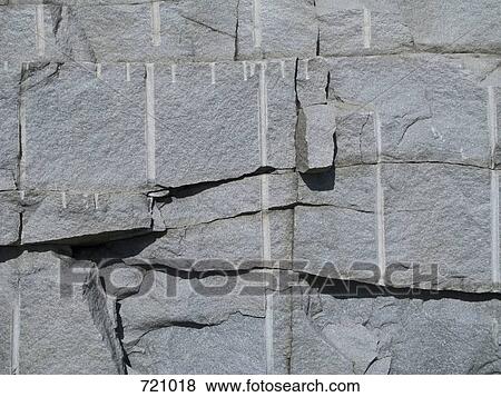 Stock Photo - A rock wall, full frame. Fotosearch