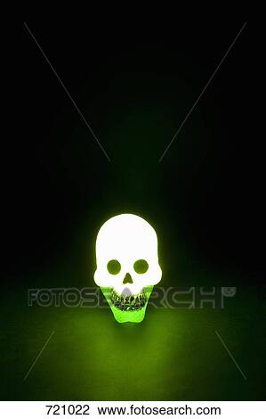 A skull illuminated in green light View Large Photo Image Stock Image - A skull illuminated in green light. Fotosearch