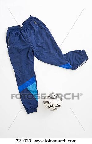 Sports trousers and a football View Large Photo Image Stock Image - Sports trousers and a football. Fotosearch