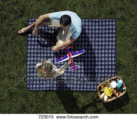 Stock Photography - A father and daughter having a picnic. Fotosearch