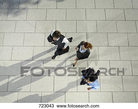 Three business people running View Large Photo Image Stock Image - Three business people running. Fotosearch