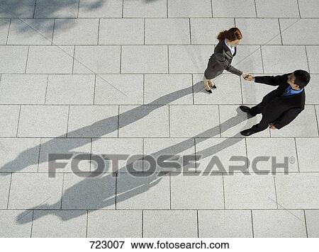 Two business people shaking hands View Large Photo Image Stock Photo - Two business people shaking hands. Fotosearch
