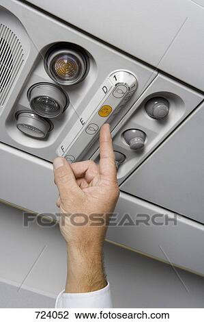 A finger pressing the call button on an airplane View Large Photo Image Stock Image - A finger pressing the call button on an airplane. Fotosearch