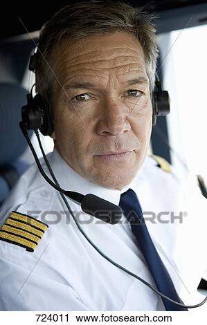 A pilot in a cockpit View Large Photo Image Stock Image - A pilot in a cockpit. Fotosearch