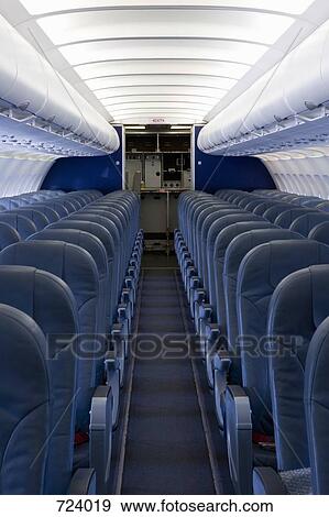 The empty cabin of an airplane View Large Photo Image Stock Photo - The empty cabin of an airplane. Fotosearch