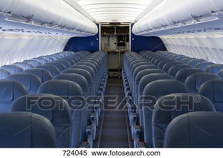 The empty cabin of an airplane View Large Photo Image Stock Photography - The empty cabin of an airplane. Fotosearch