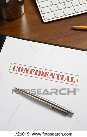 Stock Photo - A confidential file on a desk. Fotosearch