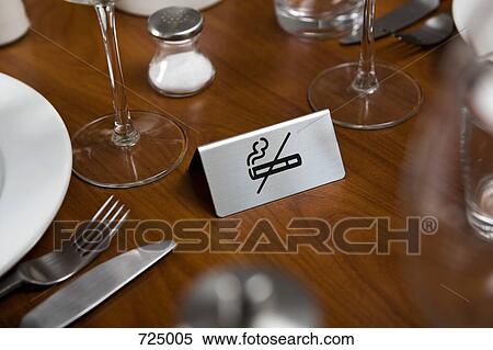 A No Smoking sign on a dining table View Large Photo Image Stock Photography - A No Smoking sign on a dining table. Fotosearch