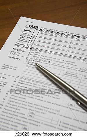A tax form and a pen View Large Photo Image Stock Image - A tax form and a pen. Fotosearch