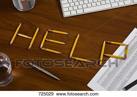 Pencils on a desk arranged to spell Help View Large Photo Image Stock Photo - Pencils on a desk arranged to spell Help. Fotosearch