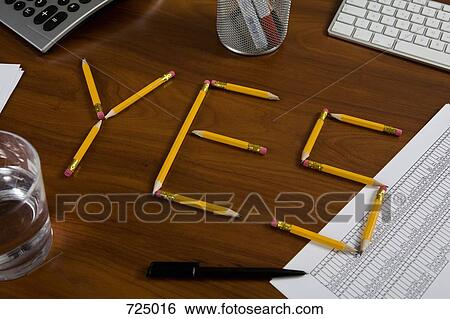 Pencils on a desk arranged to spell Yes View Large Photo Image Stock Photograph - Pencils on a desk arranged to spell Yes. Fotosearch