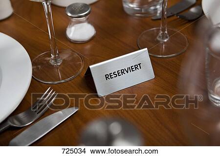 Reserved Sign on a dining table View Large Photo Image Picture - Reserved Sign on a dining table. Fotosearch