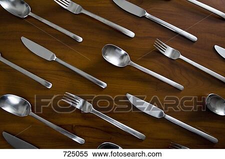 Silverware arranged in a pattern on a table View Large Photo Image Stock Photography - Silverware arranged in a pattern on a table. Fotosearch