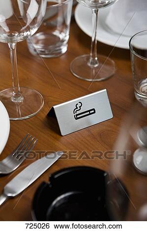 Smoking sign on a dining table View Large Photo Image Stock Photograph - Smoking sign on a dining table. Fotosearch