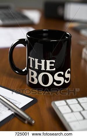 Stock Image - The Boss mug on a desk. Fotosearch