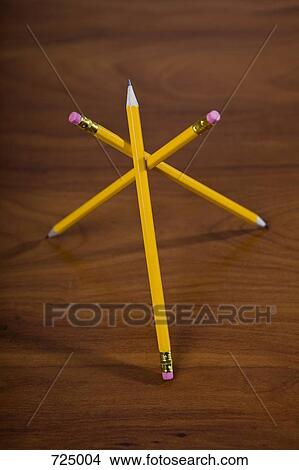 Three pencils balanced against each other View Large Photo Image Picture - Three pencils balanced against each other. Fotosearch