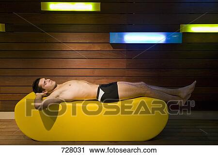 A man lying down in a sauna View Large Photo Image Stock Image - A man lying down in a sauna. Fotosearch