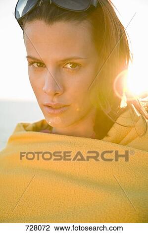 Stock Image - A woman wrapped in a towel. Fotosearch