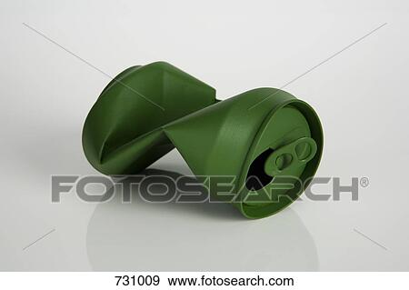 A crushed soda can painted green View Large Photo Image Stock Photo - A crushed soda can painted green. Fotosearch