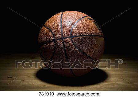 A spot lit basketball View Large Photo Image Stock Image - A spot lit basketball. Fotosearch