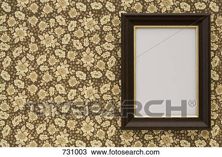 An empty frame hanging on wallpaper View Large Photo Image Stock Image - An empty frame hanging on wallpaper. Fotosearch