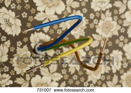 Electrical wires sticking out of a wallpapered wall View Large Photo Image Stock Photo - Electrical wires sticking out of a wallpapered wall. Fotosearch