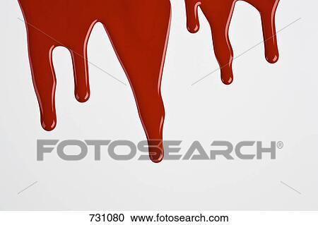 Stock Image - Red paint dripping down a white wall. Fotosearch