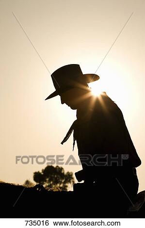 Silhouette of cowboy sitting on a horse View Large Photo Image Stock Photograph - Silhouette of cowboy sitting on a horse. Fotosearch