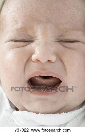 A crying newborn baby View Large Photo Image Stock Image - A crying newborn baby. Fotosearch