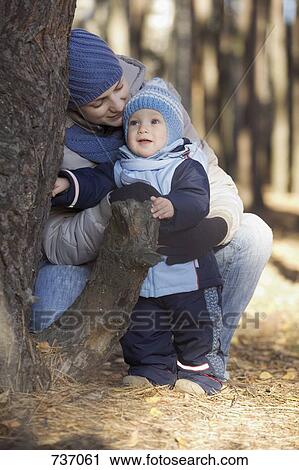 A mother and son outdoors, autumn View Large Photo Image Stock Image - A mother and son outdoors, autumn. Fotosearch