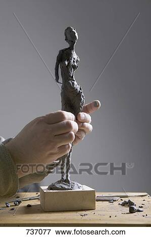 Human hands working on a sculpture View Large Photo Image Stock Photo - Human hands working on a sculpture. Fotosearch
