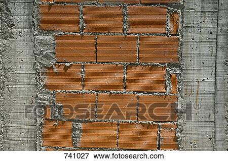 Stock Photo - A cement and brick wall. Fotosearch