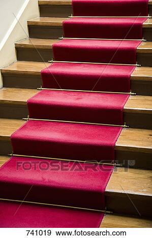 Stock Photo - A red carpet on a staircase. Fotosearch