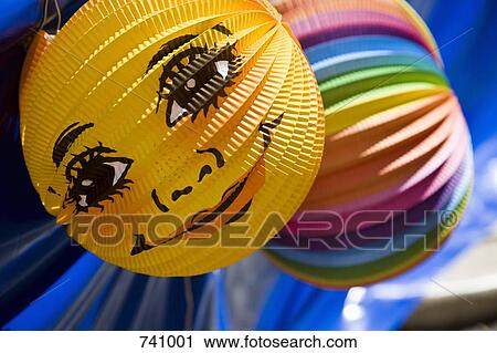Stock Image - Multi colored paper decorations. Fotosearch