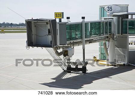 Stock Photo - Passenger boarding bridge at an airport. Fotosearch