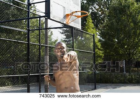 A man pointing in celebration View Large Photo Image Stock Photography - A man pointing in celebration. Fotosearch